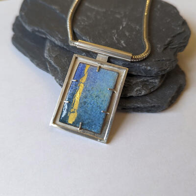Blues and gold enamel frame pendant