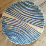 Carved dish with three feet