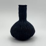 Twined vessel. Linen thread over dyed with indigo dye.