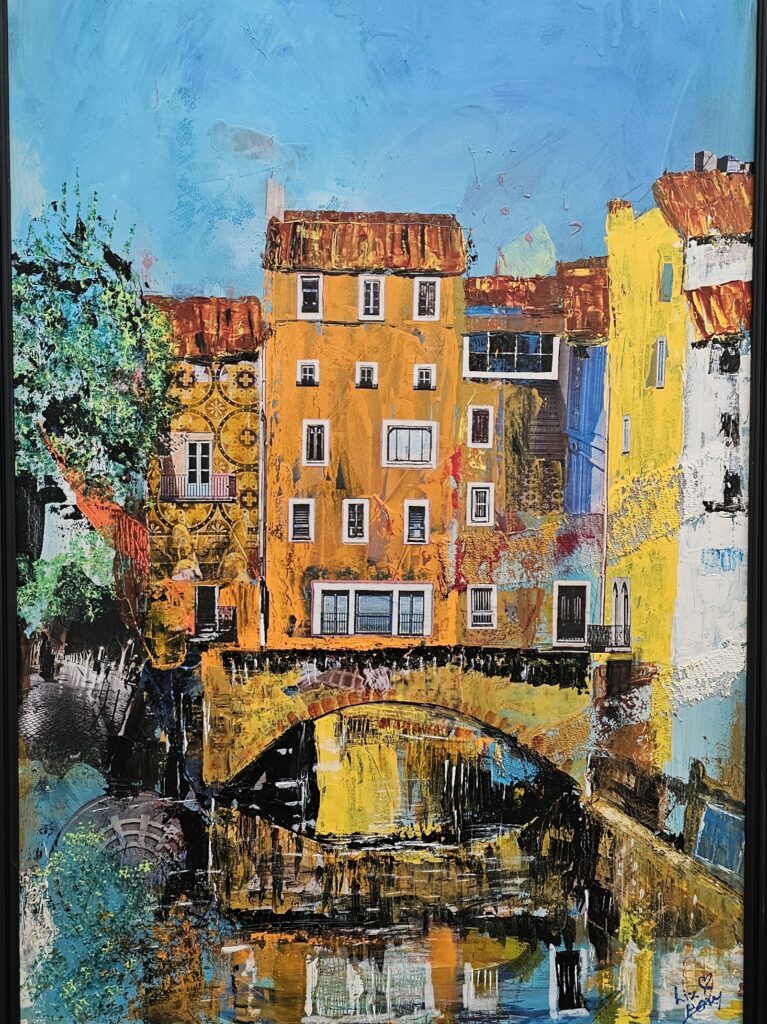 Le Pont des Reves - mixed media painting, collage, paint, layered elements,  depicting a bridge and buildings over a canal in the south of France
