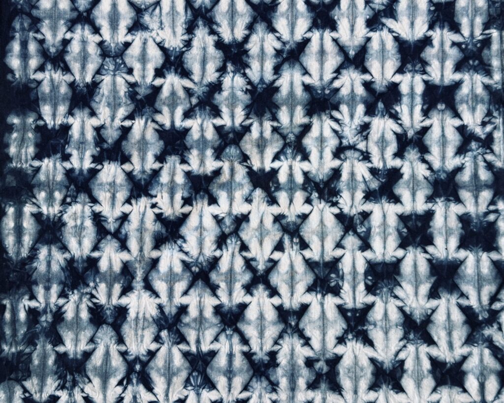 A Shibori, stitch resist cotton fabric. Dyed with Indigo dye