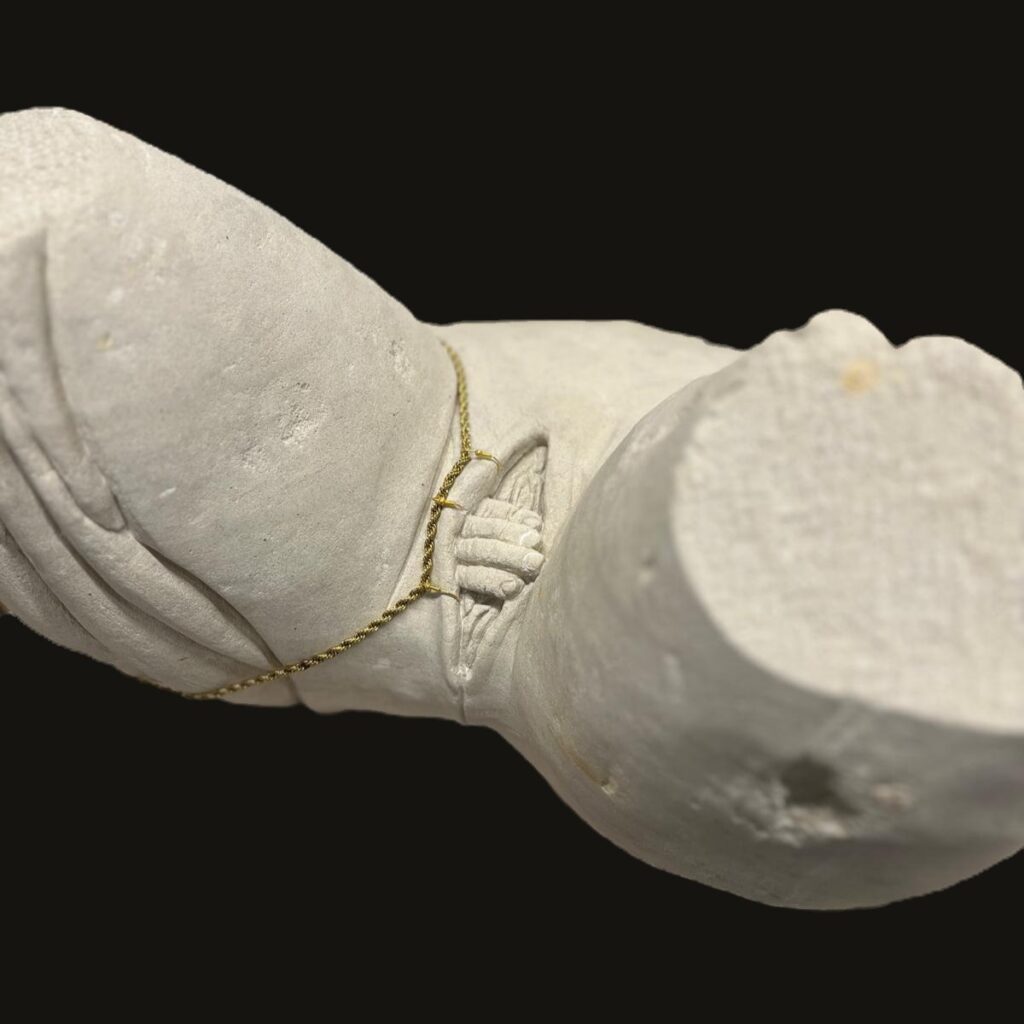 Carved in limestone, The First Touch captures a moment when life first meets the world